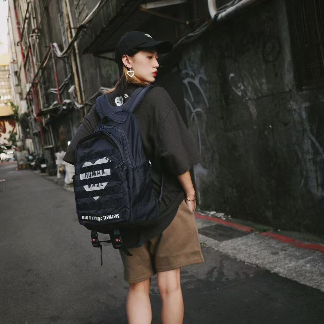 Streetwear Brand Backpack - HUMAN MADE กระเป๋าเป้สะพายหลังทหาร แบรนด์อินเทรนด์ ชุดทำงานทหาร กระเป๋าเป้สะพายหลังไนลอนสำหรับผู้ชายและผู้หญิง